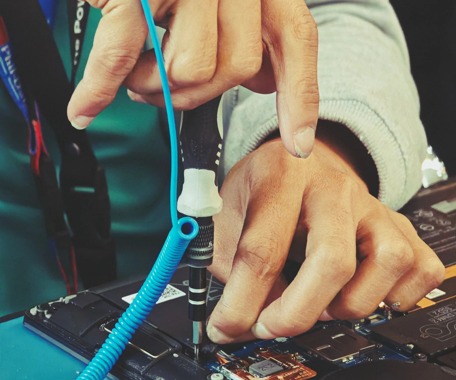 Open laptop components being examined during repair work