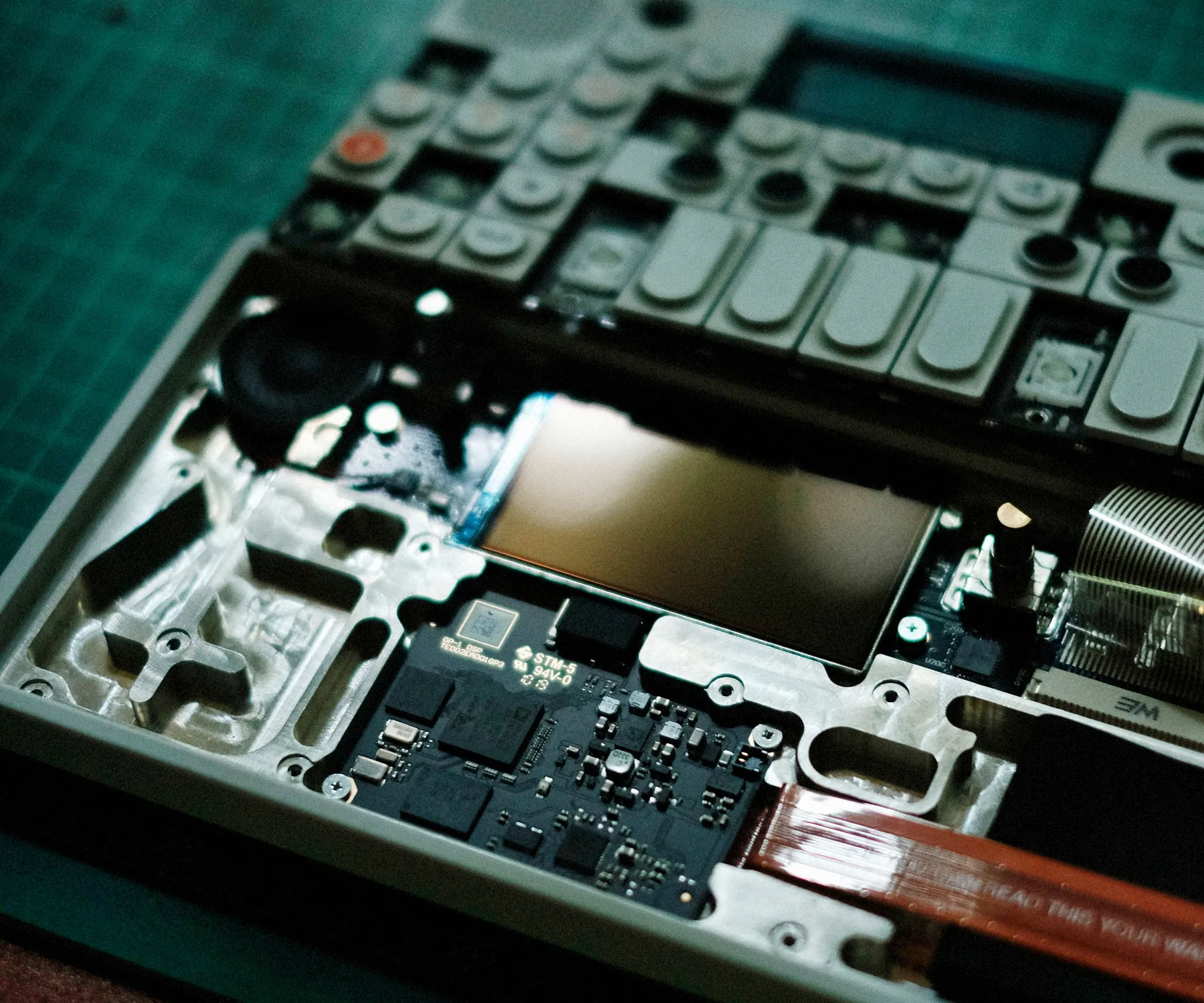 Partially disassembled electronic equipment with its internal circuit board exposed